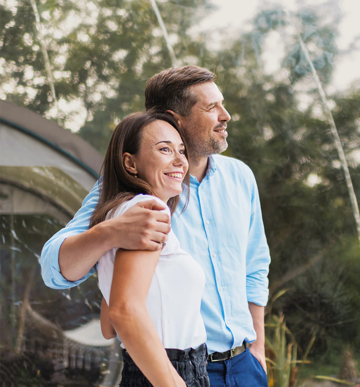 Happy couple embracing outdoors